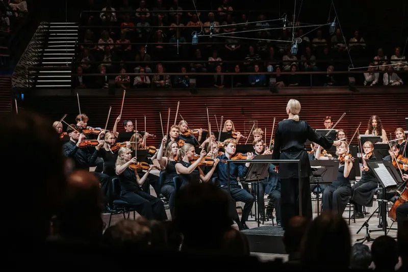 Orchestra performing on the concert stage at Musiikkitalo
